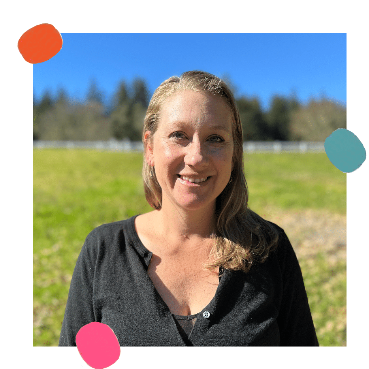 Headshot of Athena team member Dani standing in a field